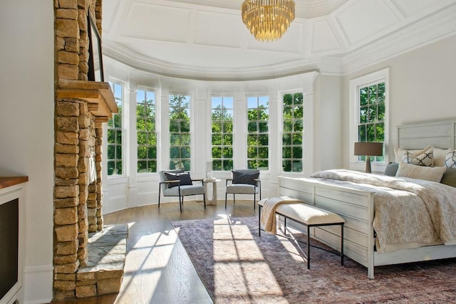 6756 Hedge Row Ln, Gainesville, GA 30506 - bedroom with wood finished floors, ornamental molding, and a chandelier