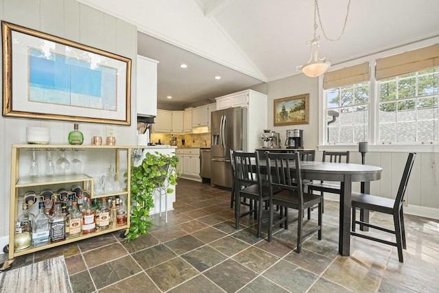3734 Powers Ferry Rd NW, Atlanta, GA 30342 - dining area featuring stone tile flooring, lofted ceiling, recessed lighting, and crown molding