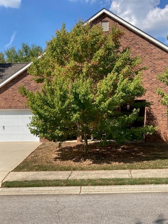 view of side of home featuring a garage