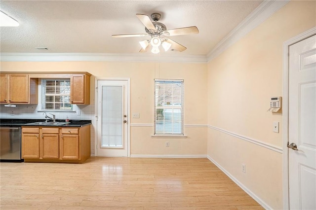 kitchen featuring dishwasher, plenty of natural light, sink, and light wood-type flooring