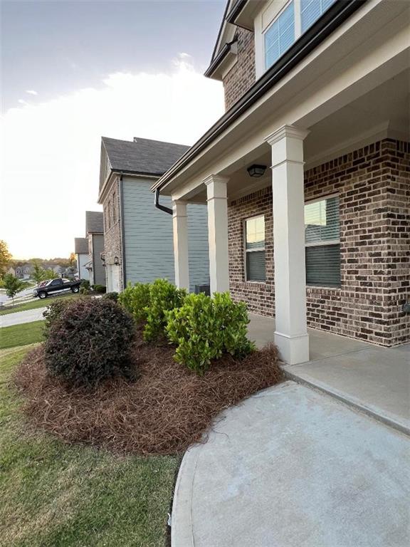 view of side of home featuring a porch