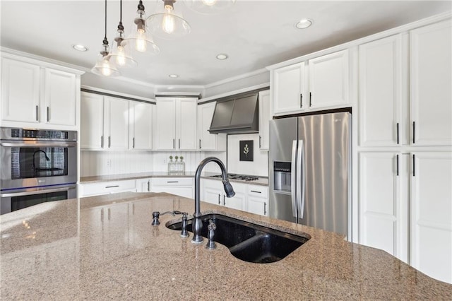 kitchen with appliances with stainless steel finishes, sink, custom exhaust hood, and dark stone countertops