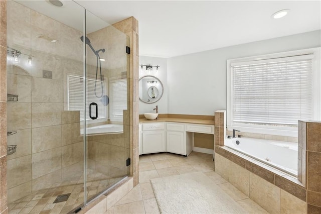 bathroom featuring shower with separate bathtub, vanity, and tile patterned floors