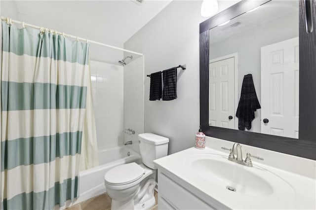 full bathroom with vanity, toilet, and shower / bath combo with shower curtain