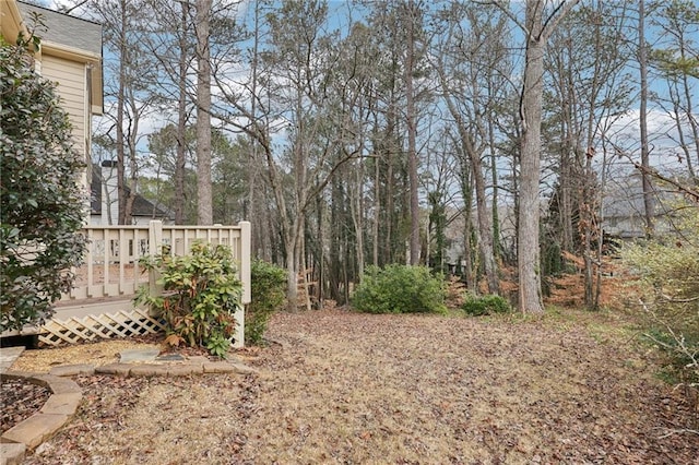 view of yard with a wooden deck