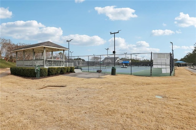 view of home's community with a gazebo, a lawn, and tennis court