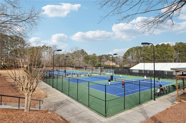 view of pool with tennis court