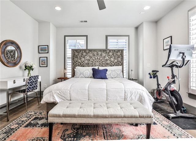 bedroom with recessed lighting, visible vents, ceiling fan, and wood finished floors