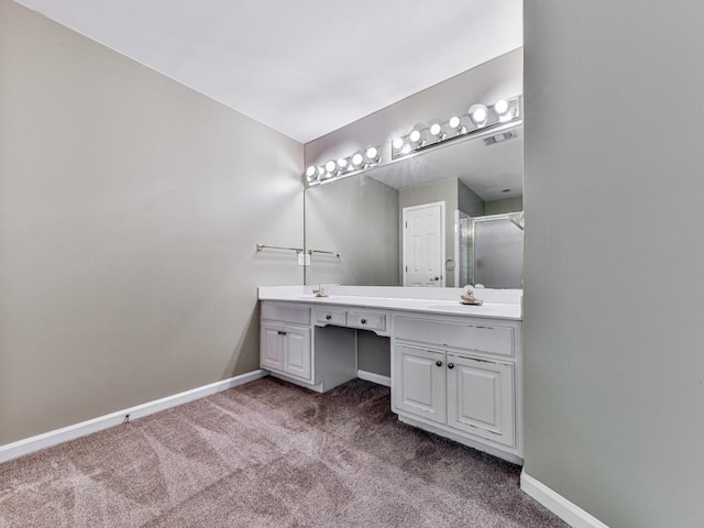 4601 Ethel Springs Trl SW, Mableton, GA 30126 - bathroom featuring double vanity, baseboards, and an enclosed shower