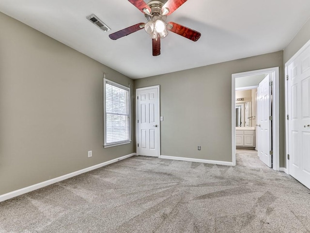 4601 Ethel Springs Trl SW, Mableton, GA 30126 - unfurnished bedroom with baseboards, carpet flooring, connected bathroom, and a ceiling fan