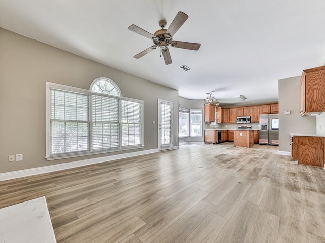 4601 Ethel Springs Trl SW, Mableton, GA 30126 - unfurnished living room featuring light wood-type flooring, ceiling fan, and baseboards