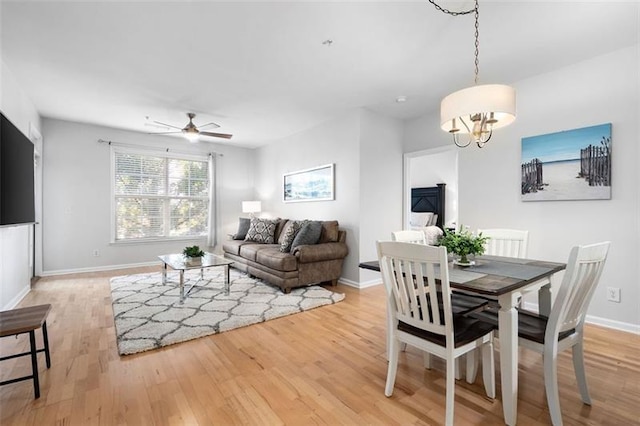 1975 Nocturne Dr Unit 2303, Alpharetta, GA 30009 - dining space with light wood-type flooring, a chandelier, a ceiling fan, and baseboards