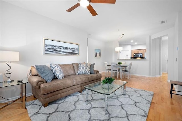 1975 Nocturne Dr Unit 2303, Alpharetta, GA 30009 - living area with a ceiling fan, light wood-style flooring, and baseboards