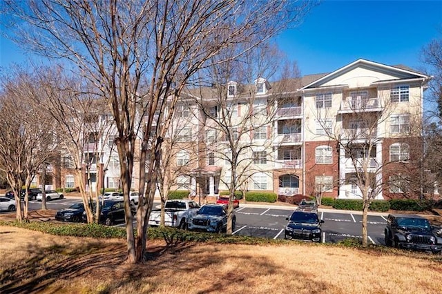 1975 Nocturne Dr Unit 2303, Alpharetta, GA 30009 - view of apartment building / complex featuring uncovered parking