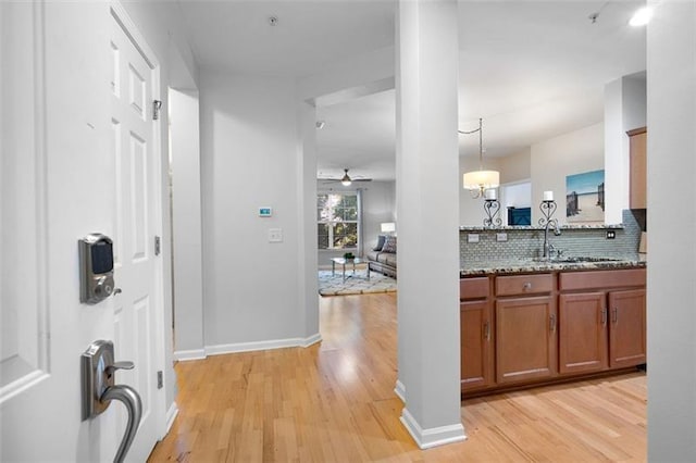 1975 Nocturne Dr Unit 2303, Alpharetta, GA 30009 - corridor with a sink, light wood-style flooring, and baseboards