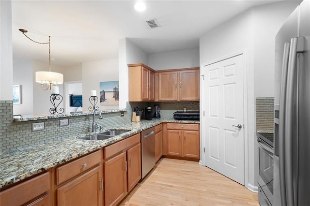 1975 Nocturne Dr Unit 2303, Alpharetta, GA 30009 - kitchen featuring a sink, stainless steel appliances, decorative backsplash, light wood-style floors, and light stone counters