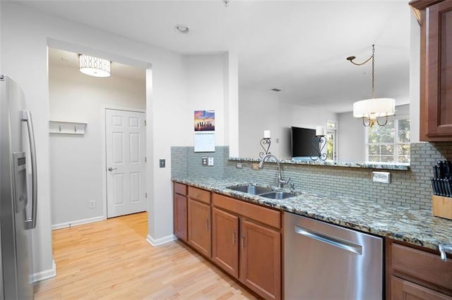 1975 Nocturne Dr Unit 2303, Alpharetta, GA 30009 - kitchen with stainless steel appliances, a sink, tasteful backsplash, and light wood-style floors
