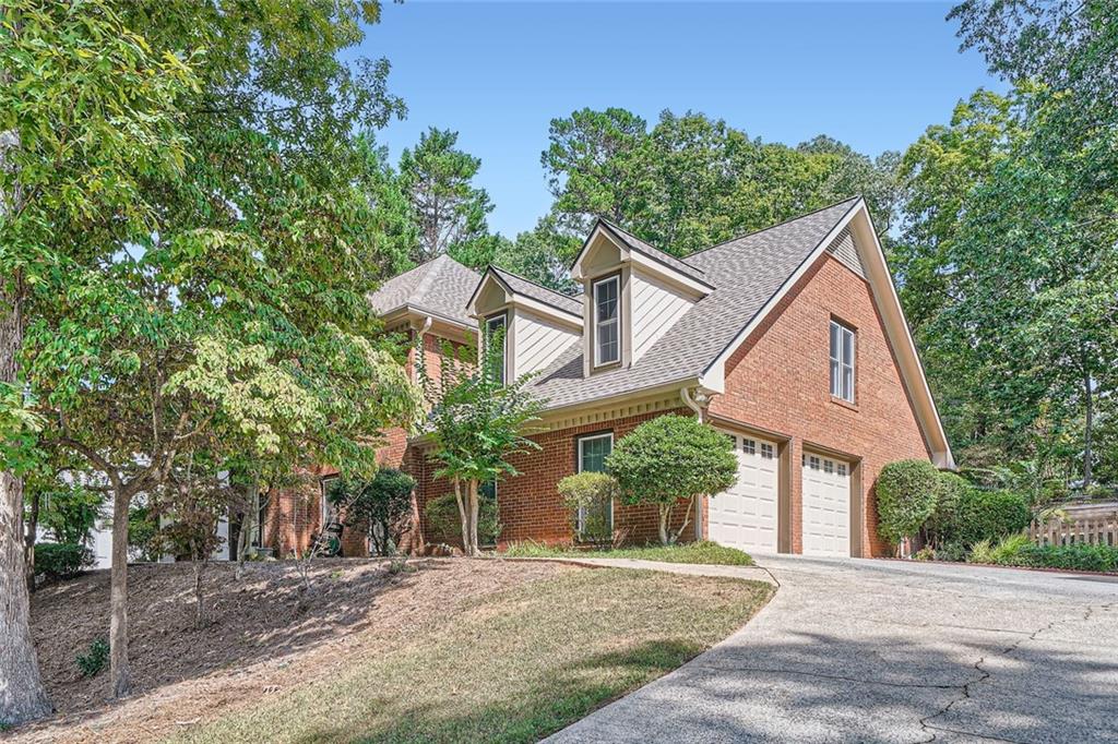 1135 Charlton Trce, Marietta, GA 30064 - cape cod house with a garage and a front lawn