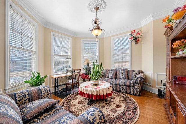 interior space featuring ornamental molding and light wood-type flooring