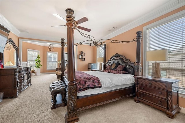 bedroom featuring carpet floors, ornamental molding, and a ceiling fan