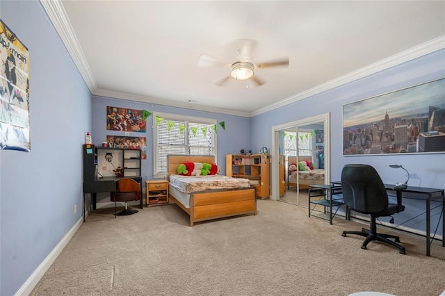 bedroom with carpet flooring, crown molding, baseboards, and ceiling fan