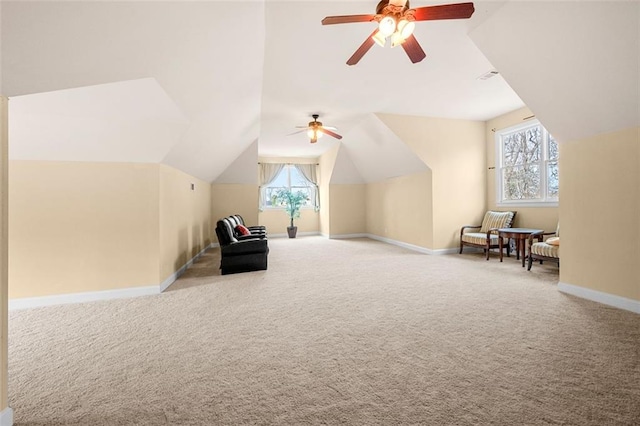 bonus room with lofted ceiling, carpet floors, ceiling fan, and baseboards