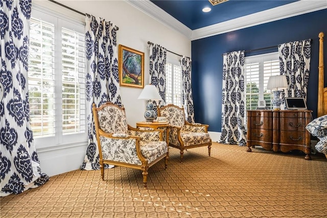 living area with carpet floors and ornamental molding