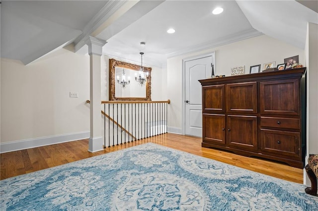 interior space with a chandelier, recessed lighting, light wood-style flooring, and baseboards