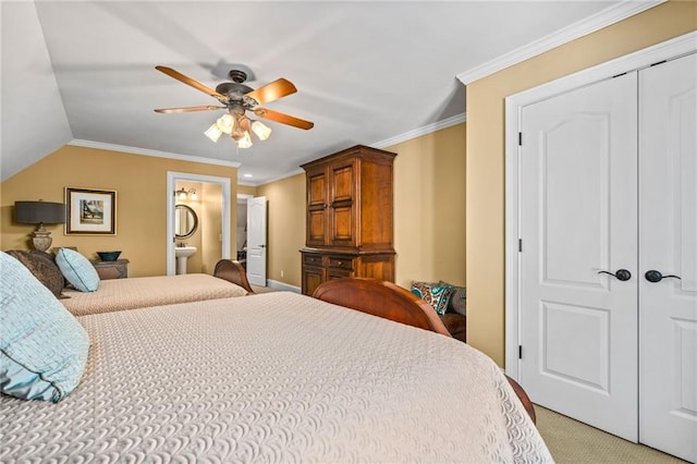 bedroom featuring ceiling fan, light colored carpet, a closet, and ornamental molding