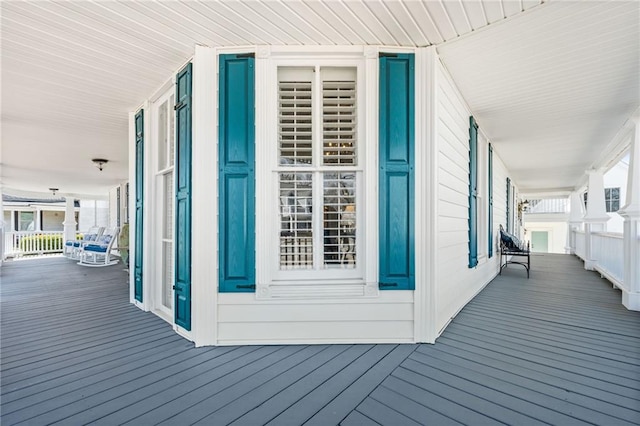 wooden terrace with a porch