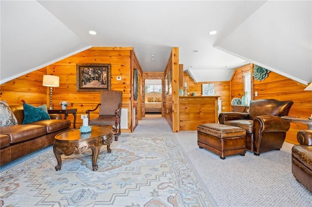 living room featuring light carpet, wooden walls, recessed lighting, and lofted ceiling