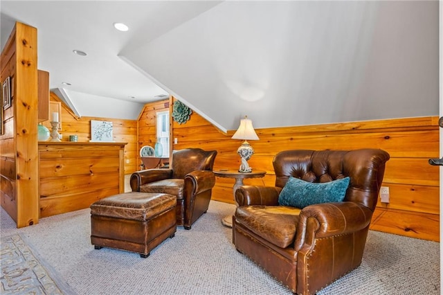 living area with recessed lighting, wooden walls, carpet flooring, and vaulted ceiling