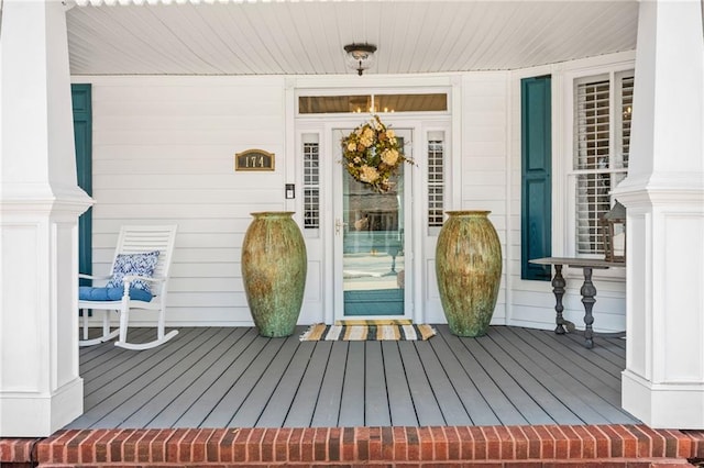 view of exterior entry featuring a porch