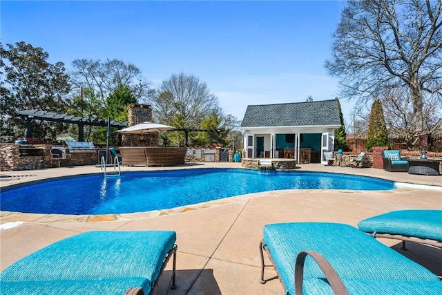 view of swimming pool with an outbuilding, area for grilling, fence, an exterior structure, and a patio area