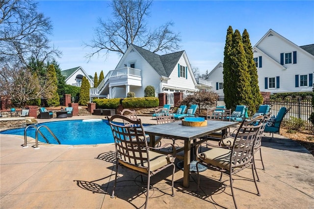 view of swimming pool with a fenced in pool, a patio area, and fence