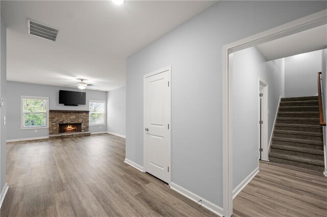 526 Wilbanks Rd, Alto, GA 30510 - unfurnished living room featuring stairs, wood finished floors, ceiling fan, baseboards, and visible vents
