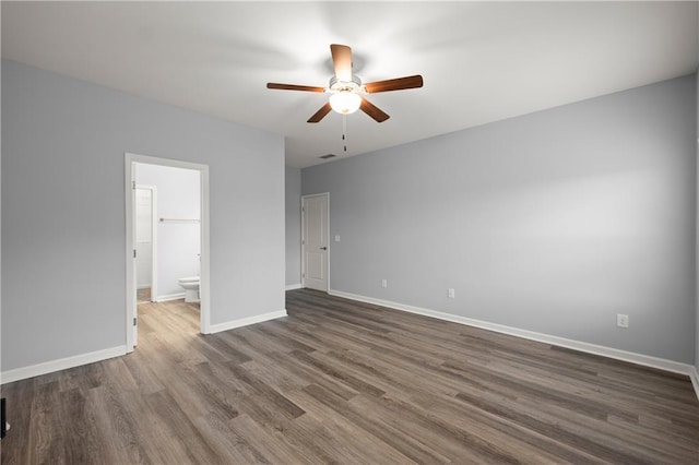 526 Wilbanks Rd, Alto, GA 30510 - unfurnished bedroom with baseboards, dark wood-style floors, and ensuite bathroom