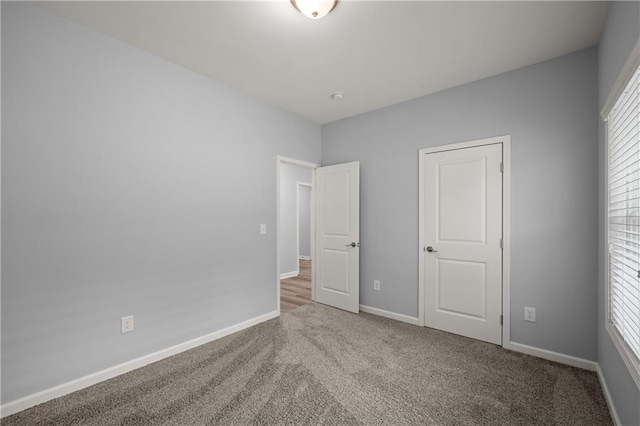 526 Wilbanks Rd, Alto, GA 30510 - unfurnished bedroom with baseboards and carpet flooring