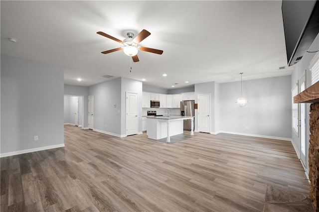 526 Wilbanks Rd, Alto, GA 30510 - kitchen with an island with sink, white cabinetry, stainless steel appliances, and a sink