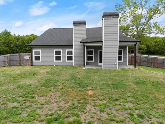 526 Wilbanks Rd, Alto, GA 30510 - rear view of property featuring a patio area, a lawn, a chimney, and a fenced backyard