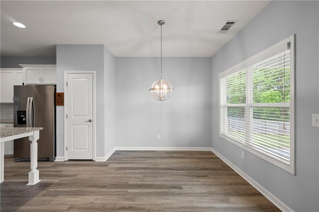 526 Wilbanks Rd, Alto, GA 30510 - unfurnished dining area featuring visible vents, baseboards, dark wood-style floors, and an inviting chandelier