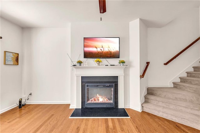 unfurnished living room featuring hardwood / wood-style floors