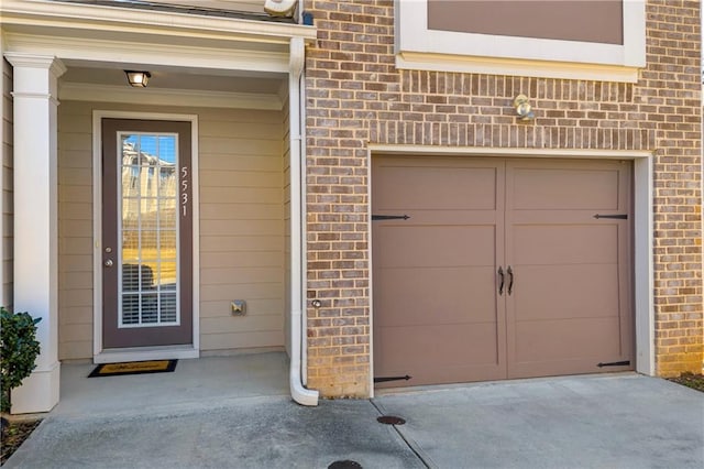 entrance to property featuring a garage