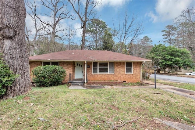 ranch-style house featuring a front yard, crawl space, and brick siding