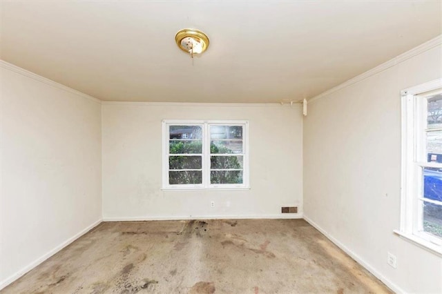 spare room with carpet, baseboards, and crown molding