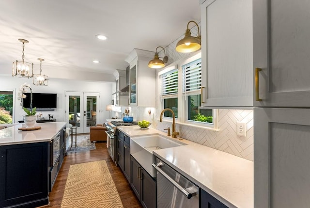 522 Trabert Ave NW, Atlanta, GA 30309 - kitchen with appliances with stainless steel finishes, french doors, plenty of natural light, light countertops, and recessed lighting