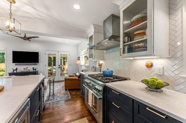522 Trabert Ave NW, Atlanta, GA 30309 - kitchen featuring stainless steel range, open floor plan, wall chimney exhaust hood, plenty of natural light, and recessed lighting