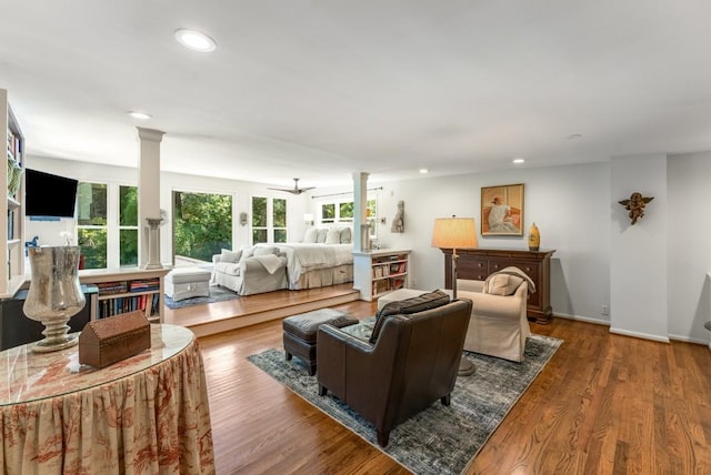 522 Trabert Ave NW, Atlanta, GA 30309 - living room featuring decorative columns, wood finished floors, and recessed lighting