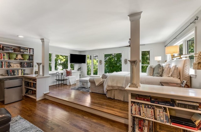 522 Trabert Ave NW, Atlanta, GA 30309 - living room featuring decorative columns and wood finished floors