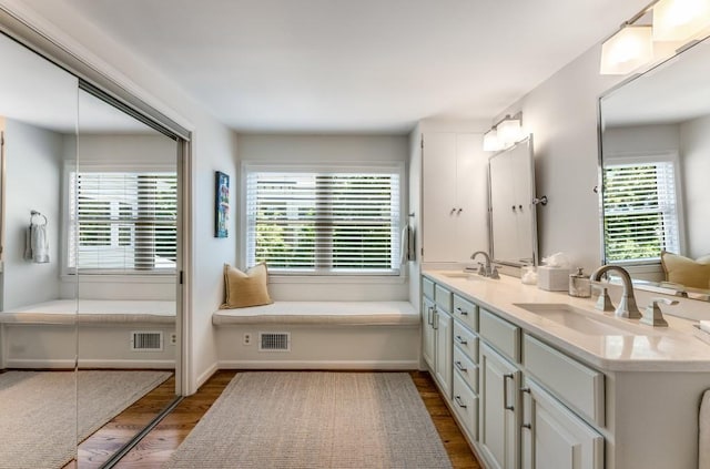 522 Trabert Ave NW, Atlanta, GA 30309 - bathroom featuring wood finished floors and double vanity
